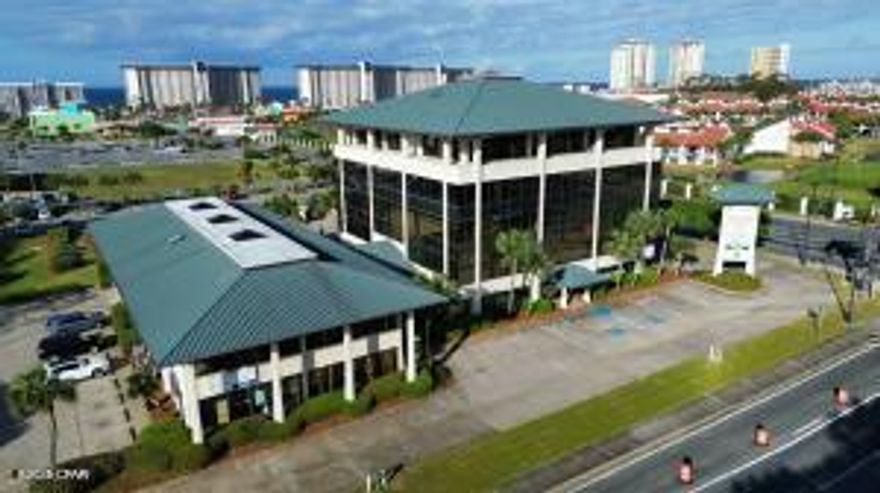 Strategically positioned with high visibility at the lighted intersection of Hutchison Boulevard (Middle Beach Road) and Richard Jackson Boulevard.  Adjacent FDOT AADT counts of +/-22,000 & 44,000.  Unit includes approximately 1929 sq. ft.  Property is home to a strong tenant mix and benefits from its proximity to major resorts, residential developments and entertainment destinations.  Located .25 miles from the beach and 3.5 miles from Pier Par, the site enjoys year-round traffic driven by tourism and a fast growing local population.  Space includes a roll-up door for convenient access.  Lease excludes phone, cable, internet, janitorial.  CAM fees are additional.  Electric, water and common area janitorial are prorated and invoiced based on tenant's pro rata share of building.