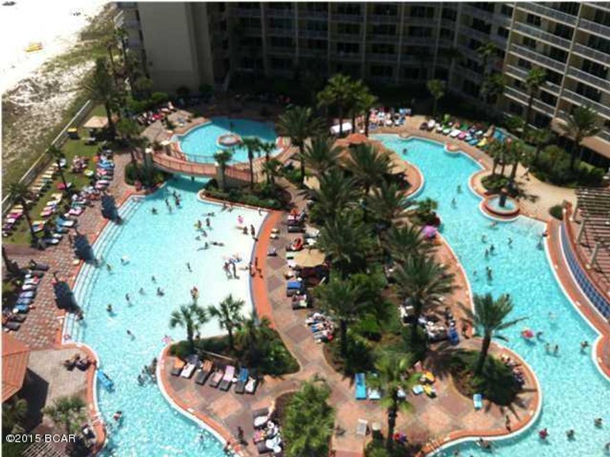 Highly Desirable Lower floor ''L'' unit with many upgrades. Owner has added stainless steel appliances, tiled flooring through living/dining area. 2 Bed 2.5 Bath with a full Bunk Room, not just a cut out in the hall!  Master Bed faces the gulf and has a sliding glass door to the over-sized balcony. Comes with a 5th floor reserved parking space!  Shores of Panama has amenities galore including a 14,000 sq.ft. tropical lagoon pool, tiki bar, hot tub, sauna, steam room, excercise room and more!  Don't miss this opportunity for one of the best units at the Shores of Panama!