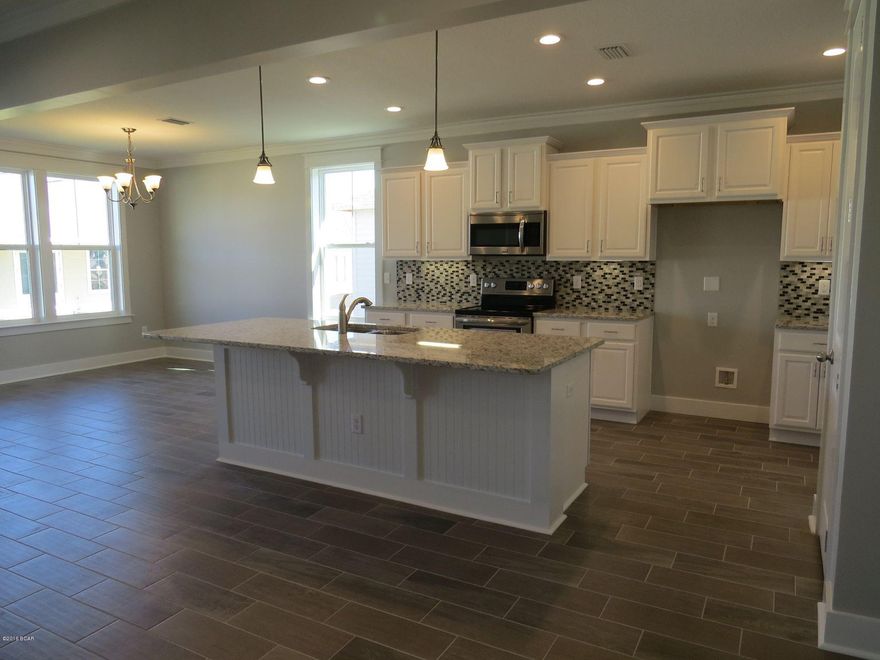 This home is move in ready! This gorgeous home has a Bonita Floor Plan with a Craftsman Elevation. A Samuel Taylor built home includes standard features such as designer carpet in main areas and bedrooms, 8 ft. 2 panel craftsman interior door package, brushed nickel fixtures and faucets throughout, insulated (R19) interior common walls and insulated (R38) ceilings, and durable Sherwin Williams premium interior wall paint. Kitchen features stainless steel appliance package (range, dishwasher, & microwave) and oversized 36'' wood cabinetry with crown molding, and granite counter tops. Full bathrooms include raised vanity heights, large tile flooring in bathrooms and laundry rooms, 2 x 6 Exterior Wall Construction, and hurricane tie down rod anchor system. car garage, architectural roof shingles with an extended warranty, low maintenance aluminum fascia and vinyl soffits, termite treated foundation, Hardi-Plank siding with an extended warranty, and durable Sherwin Williams Loxon exterior paint. All new construction homes are backed by a 2-10 Home Buyers Warranty. Your HOA dues includes lawn maintenance for the home. The Whisper Dunes subdivision includes sidewalks, curb & gutter, a beautiful community pool and pool cabana. Whisper Dunes is a golf cart friendly community and you are within a short driving distance to our beautiful beaches, Pier Park shopping, NW FL Beaches International Airport, and the beautiful 30A South Walton area. Choose your lot, floor plan & elevation, choose your design options, and pick your paint colors! All measurements and sizes are approximate, please measure for accuracy and verify all sizes.