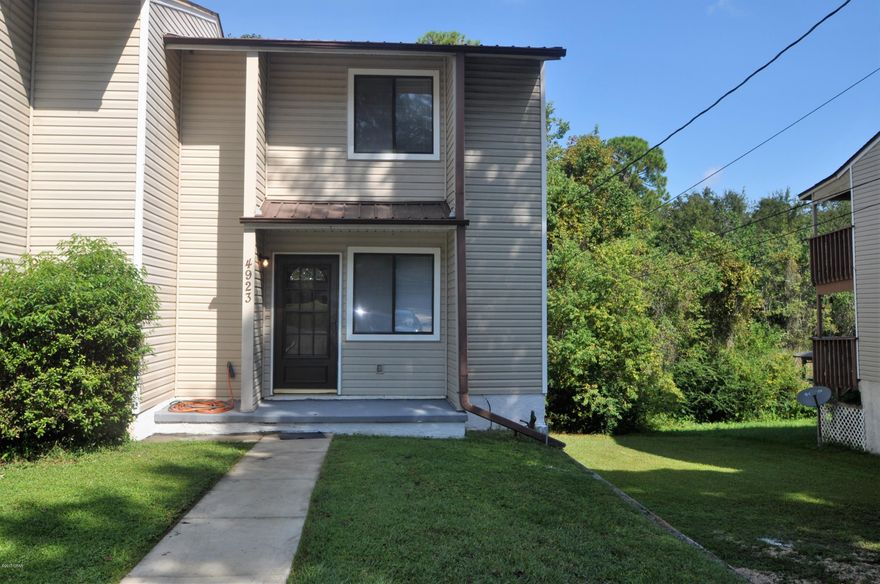 Rare find. this just Completely remodeled WATERFRONT end unit 2 bedroom townhome close to Tyndall AFB. Brand new roof, floor, hot water heater and decks. Speaking of decks, it has a just rebuilt huge party deck. Stand on it and look over Martin Bayou that goes all the way out to St Andrews Bay. Put your Kayak or canoe in for a great workout. It has a 16 x 32 basement for great storage. Upstairs deck has a huge storage unit that could be turned into an amazing master bedroom closet. at night sit in your chair on the deck and watch the sunset. So much you can do here. Would make a great rental unit also. Other townhomes in the area bring in $850/mo and they are in no way the condition of this property. Just about everything is brand new. Move in ready and NO HOA