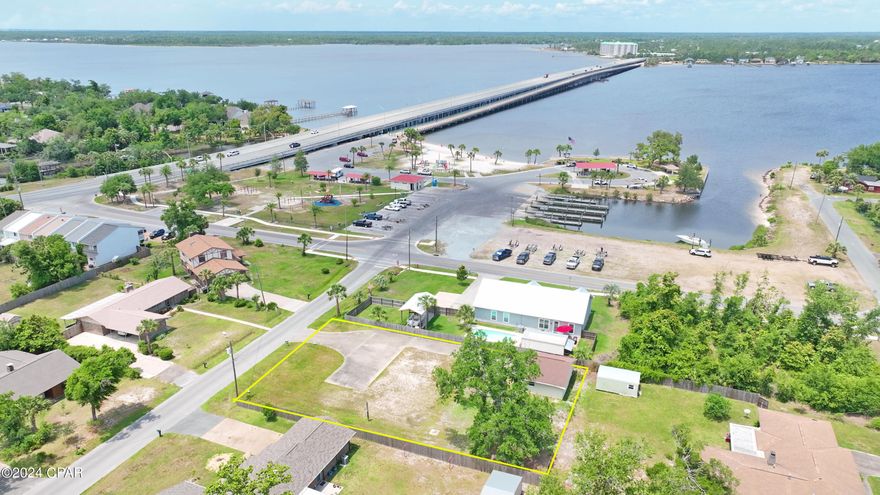 307 Michigan Ave, Lynn Haven, 100x150 lot, located steps from the bay as well as Leslie Porter Park with a public boat ramp and enjoy a walk across North Bay on the Bailey Bridge, so much to enjoy in Lynn Haven! The lot is high, has power, water, concrete slab and frame 30x25 building with 2 car garage and additional storage / workshop with power. No HOA, your boat, RV are welcome. Bring your contractor and plan your new build today on what is considered the best vacant lot available in Lynn Haven today!