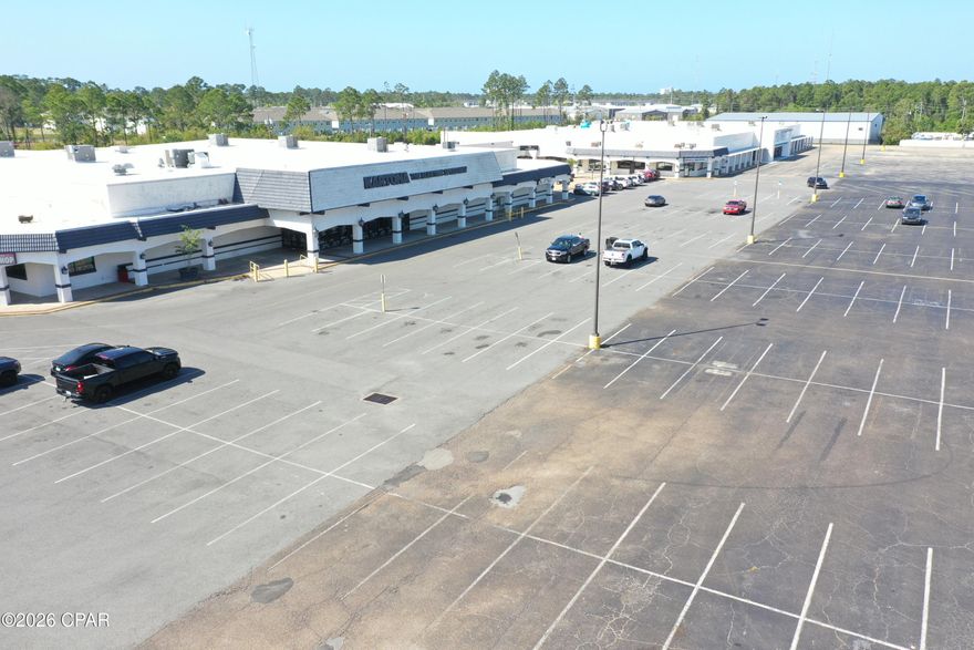 33,387 Square Feet Available for lease in Beachwalk Shopping Center. The former Kartona Electric Speedway (go cart track) space is now available for lease. Originally a Delchamps Grocery Store. The 33,387 square foot retail space is currently the largest retail space available in Panama City Beach. Ideal for retail, showroom, and family entertainment. Tremendous signage and exposure to U.S. Highway 98 and Navy Boulevard. Easy ingress and egress and a parking ratio of 8 per 1,000. Planet Fitness is leasing 20,000 sq. ft. in the former Lindsey's Furniture/WalMart space in the west-end of Beachwalk Shopping Center. Call for details and to schedule a tour.