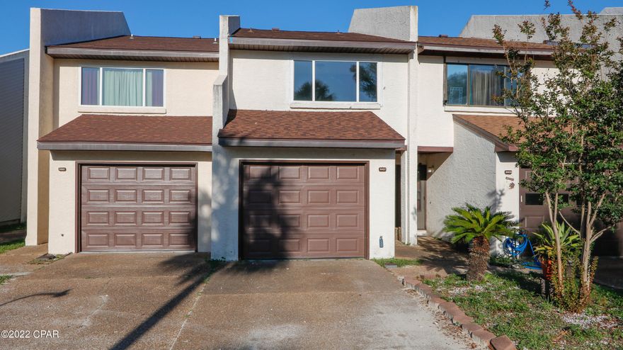 WATERFRONT LIVING! If having your own Beach at the foot of your oversized deck sounds good than this home is waiting for you. Hidden on East Bay there is a quaint little community. Just before you cross the bridge to Tyndall AFB directly on the Water with large decks. & Hurricane Shutters Partly renovated and updated 3 bed 2.5 bath townhouse with 1 car Garage will WOW you with the breathtaking views of open water on the Bay. Huge Deck off of the living room. Newer roof and AC with lots of room for storing your kayaks or jet skis under the deck.