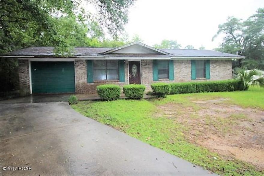 Brick house in town located at end of street at cul-de-sac.  House has good potential with good design.  The living room, dining room and kitchen has open airy design.  There are 3 bedrooms and 1 bath.  The garage was being utilized as  a den but can be turned back into garage.