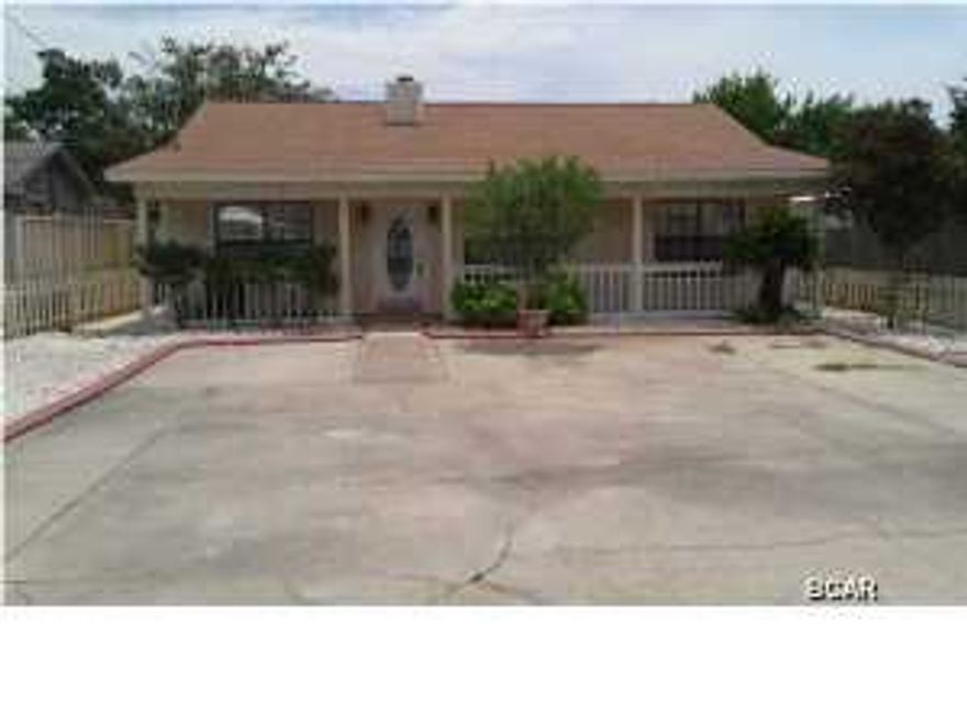 Great beach home in established neighborhood, close to Pier Park, shopping, movie theater and the worlds must beautiful beaches! This three bedroom two bath home is ready to go with new flooring, blinds,electrical switches and outlets, plus much more. Living room has a wood burning fireplace and tile flooring, all the bedrooms have wood laminate flooring for easy upkeep and double sinks in the master bath. Outside still needs a little TLC, however at this price it won't last long!