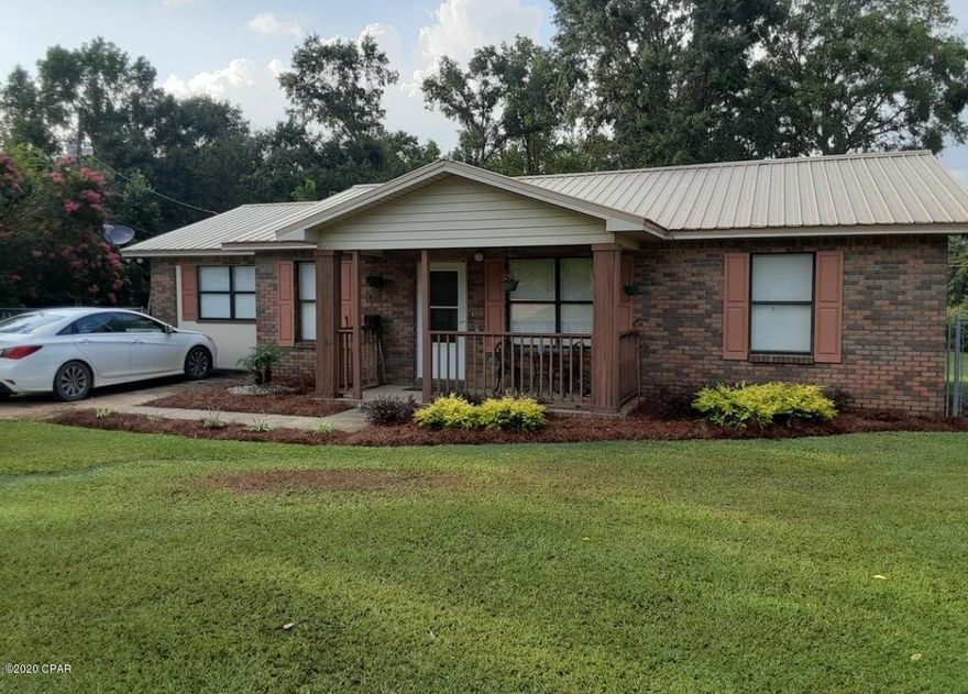 CURRENTLY UNDER CONTRACT, SELLER WILL LOOK AT BACK UP OFFERS. Don't let this charming 3/2 brick home in the country slip by. Recently updated kitchen offers new counter tops, kitchen island, plenty of storage and is open to the living and dining areas with new vinyl plank flooring. Spacious split floor plan offers a master bedroom and master bath on one side and 2 bedrooms and full bath on the other. Newer roof and CH/A. Nicely landscaped 1 acre lot. Chain link fenced back yard with room for the kids and pets. Covered front and back porches. Outbuilding for extra storage. Not far from pavement.  Easy access to Graceville, Bonifay, Chipley and Marianna for local amenities such as groceries, post office, and small local businesses. Close enough to Dothan, AL for brand name store fronts, hospitals, medical facilities, and more. Make your appointment today to see this cute home.
