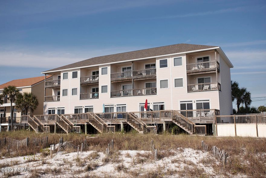 Gulf front 3 Story Town Home by design.  Condo by ownership .  Unique 5 unit building with common pool .  Four Bedroom  Four  & 1/2 Bath with 2 beachfront master bedrooms.   Great rental property.  Located @ desirable  west end of Panama City Beach .
