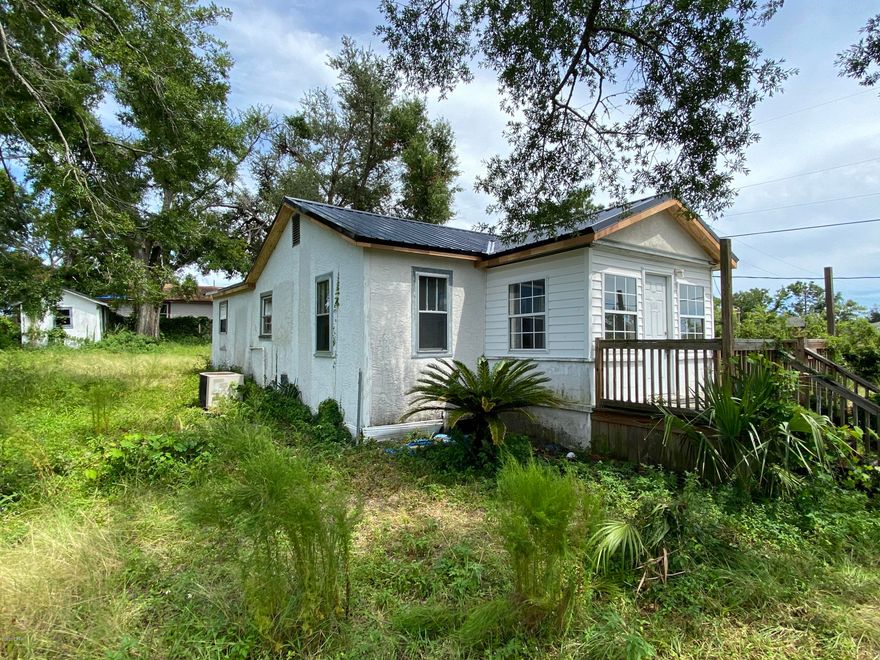 This St. Andrew's bungalow is a remodel project.  Sitting on a large corner of Clay and 14th street.   Metal roof and facia/soffit repairs complete.  Price is firm for ''as is'' cash only sale.  Stucco repair and paint will be completed next and price will increase.  Projected estimate of price complete 135,000.  Seller is Florida Real Estate Broker.