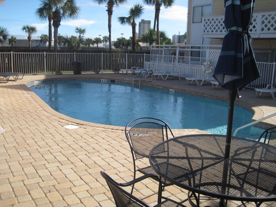 This fully furnished condo is ready to be put on a short term rental program or just keep it for yourself to have when you come down to enjoy are beautiful beaches. Sleeps four comfortably. Crown molding throughout. Tile in every room but the bedroom. Just a few steps to the beach. The large back patio over looks the pool. Low HOA fees. Great investment don't hesitate on this one. This condo has a great location, near Pier Park, Thomas Donuts, Lots of Restaurants & Shopping.