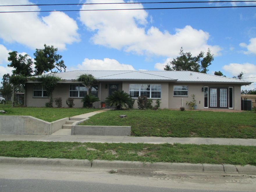 CURRENTLY UNDER CONTRACT, SELLER ACCEPTING BACKUP OFFERS - Three bedroom two bath pool home on a double corner lot with many extras.  Those include a whole house generator, new pool pump and pool liner, updated security system with 6 exterior cameras, new attic insulation and a new metal roof.  The pool is surrounded by a beautiful brick paver patio complete with an outdoor shower. The back yard is completely fenced, includes a 24' x 28' detached garage/workshop and is landscaped with orange, grapefruit and lemon trees.   The home has a bonus room just off the kitchen and another room just off the master bedroom that can easily serve as a nursery, private office or personal gym.  The home has beautiful bamboo floors in most of the primary living areas and bedrooms.