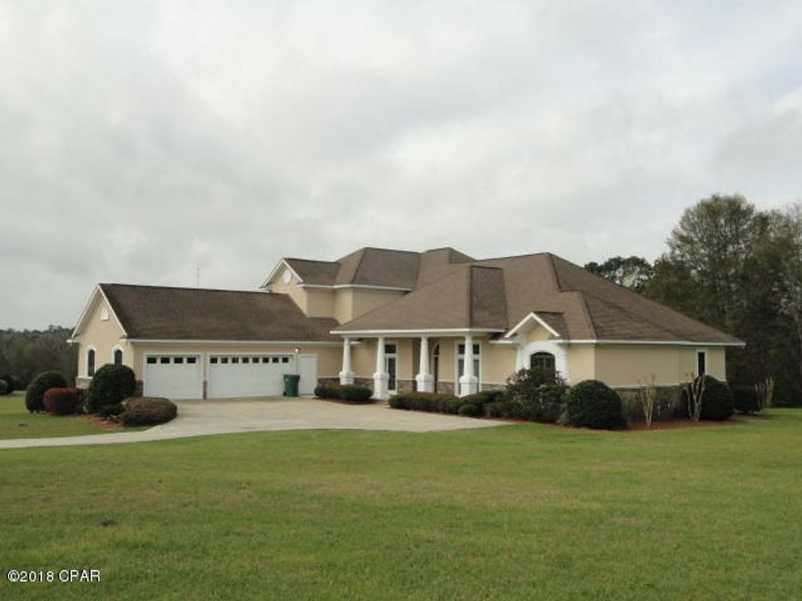 THIS TOPS THEM ALL !  Exquisite home located in prestigious Spring Chase Subdivision.  This 5 bedroom 4.5 baths with office is built with pride ready for your enjoyment.  Grand foyer with Formal Living room with recessed and accent lighting, spacious dining area with large kitchen and granite counter tops. Crown molding, Hard wood floors through out down stairs. Guest bedroom down stairs, great room, with 3 bdrm's on 2nd level.  Spacious lanai over looking a picturesque valley. All this on over 3 acres with so much more to see.