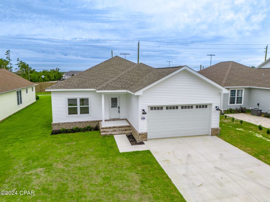 Stunning New Construction Home with Pool & Gym Access! Your new home awaits! This beautifully designed 5-bedroom, 3-bath residence offers modern living in a serene neighborhood, perfect for families and those who enjoy a peaceful lifestyle but still enjoys being a short trip to the beaches and downtown Panama City.  Enjoy a bright and airy open floor plan with so much natural lighting that seamlessly connects the living, dining, and kitchen areas. Perfect for entertaining friends or family gatherings. Five bedrooms provide plenty of space for everyone. The master suite offers a walk-in closet and an en-suite bath with double vanities. While not in the home enjoy the pool and gym that is with in the community. Shopping for the family, holidays or the next gathering  is a simple short trip with the home located minutes away from the newest Publix built in the area.