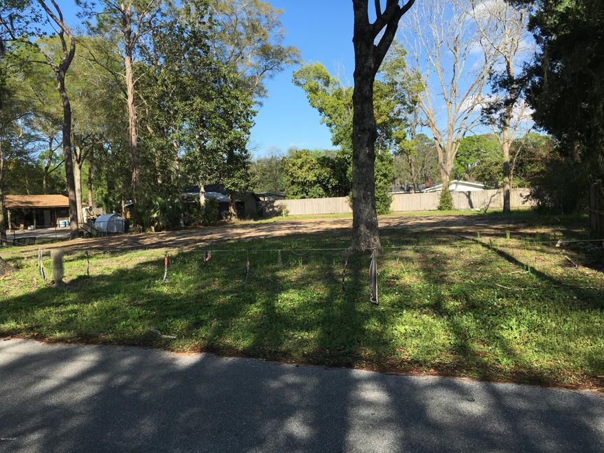 CONGRATULATIONS !!  By reading this you have the opportunity to buy a large, site ready lot to build on in the much sought after city of Lynn Haven !! And the BEST PART is it has just been REDUCED !!  The owner has prepped the site to build on. Dirt was added to level the lot and grade it for proper drainage. There is a storm water drain at the left front corner of the lot. The next day after the March 25th to the 27th 11 inch rain, there was LITTLE TO NO standing water on the lot !!  These listing pictures were taken the next day after that rain. There is currently sewer and water to the lot. It was for the previous house and is for a 2br 1 bath home. A new home with more baths would only have to pay the difference in what their new home would be and what is already done. Saving about half or more in tap fees! What a Great neighborhood and deal 

When preparing the lot, large trees were left around the perimeter of the lot offering Great shade for your new home, patio, and back yard !