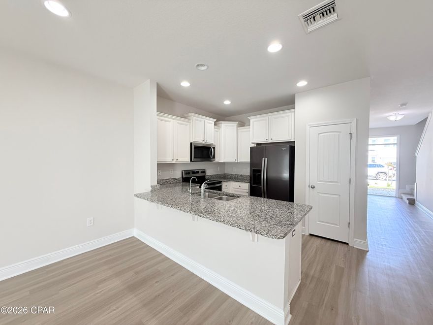 Recently refreshed and move-in ready, this well-maintained home at 7682 Shadowlake Dr offers a comfortable layout and modern updates in a desirable Panama City Beach location.

The home features updated flooring throughout, creating a clean and cohesive look while being easy to maintain. The open living area provides plenty of natural light and flows seamlessly into the kitchen and dining space, making it ideal for both everyday living and entertaining.

The kitchen offers ample cabinet space and functionality, while the bedrooms are well-sized with sufficient closet storage. The primary suite provides privacy and comfort with its own bathroom.

Located in a quiet, established neighborhood, this home offers convenient access to local shopping, dining, schools, and just a short drive to the beach.