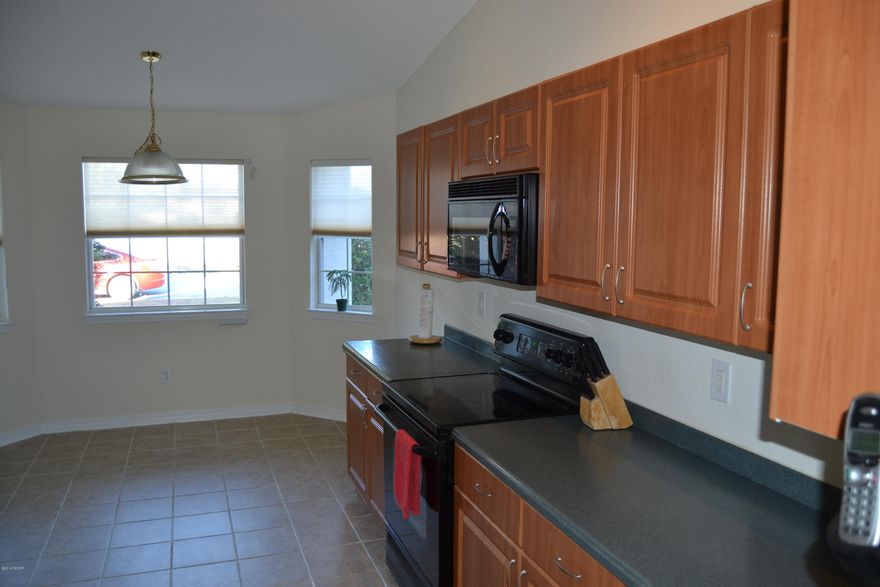 Best value in The Hammocks Subdivision!!! This 3 bedroom, 2 bath home shows like a brand new one, only tens of thousands less than new.  The interior of the home is fresh with new carpet, paint and a bright and airy feeling.  The kitchen has loads of counter top and cabinet storage and has a breakfast area AND breakfast bar.  A formal dining room is great for even more room and the living room has high ceilings and plenty of natural light.  All three bedrooms are very large and the master features a luxurious bathroom with double vanities and plenty of closet space.  Bedrooms 2 and 3 share a full bath.  The laundry room is located down the hall from the bedrooms for convenience.  A two car garage takes care of car storage.  The back yard is very private and features a covered patio area. The AC and water heater were replaced in 2014. The Hammocks is located close to schools, shopping and restaurants and has a community pool.  Call today for a private viewing.