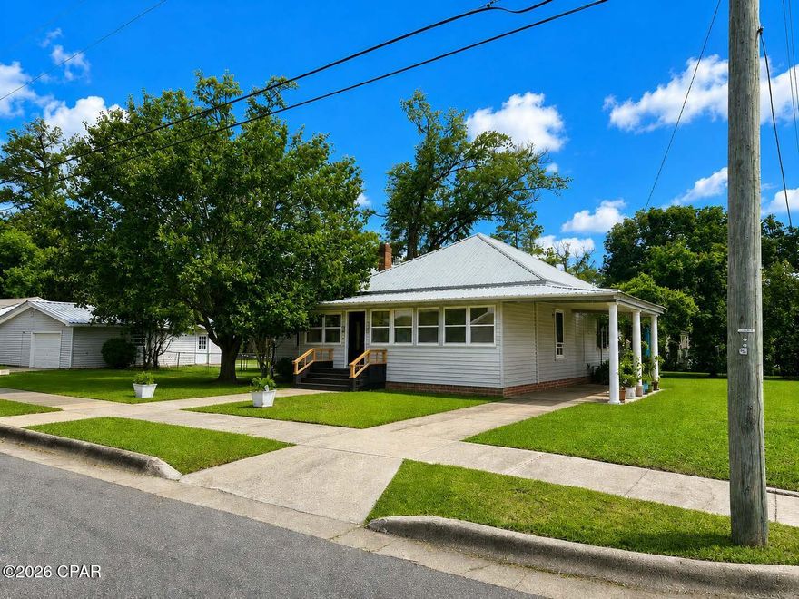 Welcome home to this beautifully updated corner-lot property that perfectly blends timeless character with modern farmhouse style. From the moment you arrive , you will notice the inviting curb appeal , mature shade trees , spacious yard and charming Southern appeal . 

Inside , the home offers warm hardwood floors throughout much of the living space ,  oversized rooms , soaring ceilings and a unique blend of rustic and contemporary finishes .  The main living room features a stunning deep teal accent wall, rich trim details and a cozy atmosphere ideal for entertaining or relaxing with the family .

The dining room is full of personality with custom lighting , dramatic dark accent walls and an easy flow into the kitchen and living room area . The dining room features a beautiful hutch that will stay with the home .

The kitchen features a beautiful rustic and colorful ceiling , a breakfast nook and a coffee bar that will stay with the home .  The refrigerator , gas stove , microwave and the gas dryer will also stay with the home .

The primary bedroom offers a warm lodge inspired feel with wood ceilings and rustic accents that create a relaxing retreat .

The other bedrooms are spacious and provide comfort and flexibility . One bedroom offers a private suite style room with its own private exterior entrance making it perfect for guests, multigenerational living and much more .

Step outside to enjoy the large screened entertainment porch complete with lighting , ceiling fans , grilling area and plenty of room for outdoor seating and game day gatherings .

This oversized corner lot also features a detached garage / man cave / she shed . The back side of this garage has a half bathroom and a tool shed or storage room . The double gates to the side of the shed allow access to the back yard .

There is currently an above ground pool . This pool can stay with the property if contracted soon, if not , it may be removed from the property .  The pool vac will not be included .

This property offers so much potential .  With proper approval , vision and some construction the garage could be converted into an apartment or mother n law suite .  

Must see to appreciate the full potential !!