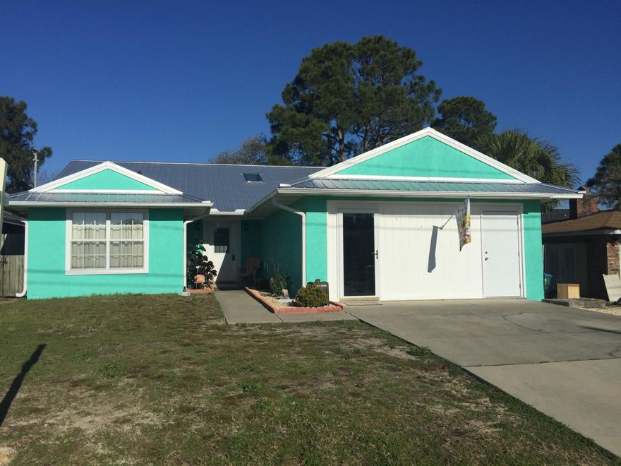 Spacious 3 bedroom, 2 bath home, located between Grand Lagoon and Thomas Drive. Just blocks from beach.  This home is in immaculate condition.  Large privacy fenced back yard with covered porch.  Brand new metal roof.  Call for appointment...