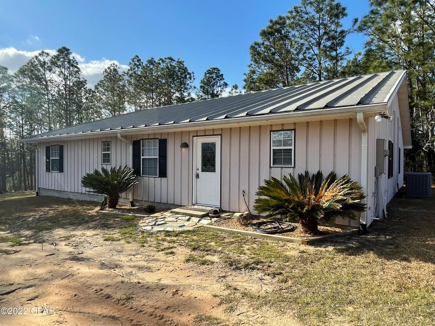 CURRENTLY UNDER CONTRACT, SELLER ACCEPTING BACKUP OFFERS. Need room for your family to grow and play?! This is the perfect home for you. This turnkey, waterfront, 4 bedroom, 2 1/2 bathroom home features an open floor plan and additional flex/bonus room. The master bedroom is waterfront with his and her closets, and en suite bathroom with double vanity.  The additional three bedrooms are on the other side of the home with a shared bathroom. The open large living, dining and kitchen are also waterfront and have doors to a deck that overlooks the spacious yard and lake in the back yard. This property has over 85' of water frontage on Lake Susan, a spring fed lake with a natural shore. This lake is a fisherman's paradise with bass and bream. The lake doesn't allow motors, but canoes and kayaks The yard is well manicured with large pine trees for shade near the lake shore. There is a yard building and shed that conveys. The property is accessible by McQuilkin, but conveyed with the property is an additional lot that adjoins and has a driveway cleared from Carvers Circle.