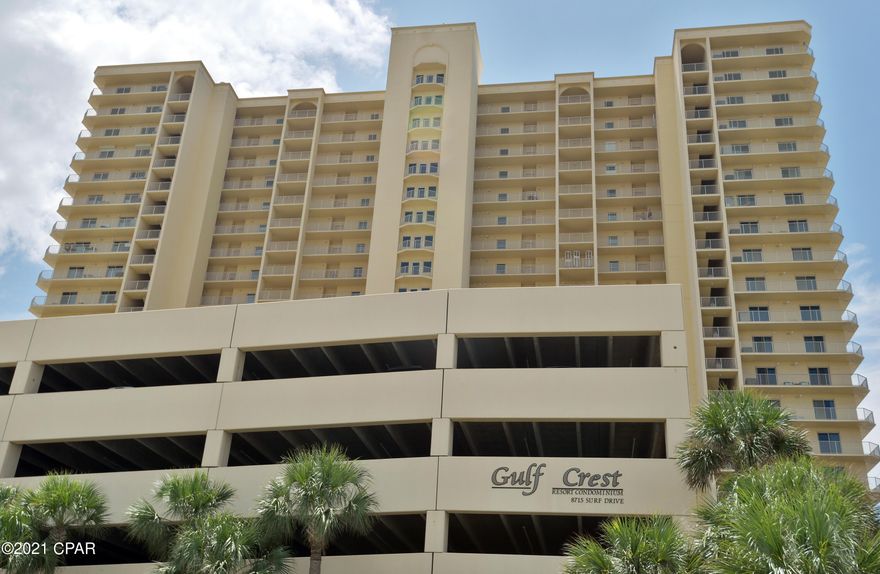 MAGNIFICENT PANORAMIC VIEWS!!!.... From this Amazing 3BR/2BA Gulf Crest Condo!!!!!  PRIME eastern corner location offers massive Gulf views from the kitchen, dining, living area, and bedrooms! Large wrap around balcony can be accessed from living area and all bedrooms as well! This unit features hard surface flooring throughout, custom tilework in the kitchen, and conveys fully furnished and rental ready. New HVAC and hot water heater installed within the last two years. The interior also includes a spacious and open floor plan with raised ceilings and a split bedroom floorplan. There is plenty of storage throughout this unit with the ample closets and oversized laundry area complete with full sized washer and dryer. A private covered parking spot also conveys with the sale. Gulf Crest Resort itself is a gated community with two gulf-front pools, whirlpools, pavilions, kiddie pool, fitness center, tiki bar & grill, and a game room. You are also within walking distance to several restaurants and family-friendly. Don't wait, come see this Spectacular Condo for yourself!!! Interior Photos Coming Soon. All dimensions are approximate and should be verified if important.