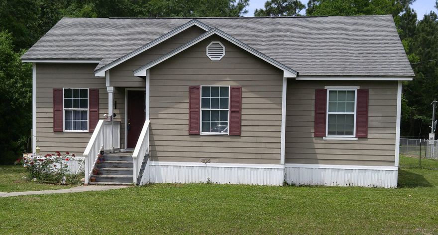 Very cute and affordable home in the heart of Southport! New bamboo flooring throughout living room, kitchen and hallway along with new paint, trim and baseboards. A new ceiling fan has been added in the living area. The bright kitchen is open to the dining area and has a Lazy Susan and pantry. The new sliding glass door opens to a nice wooden deck to the backyard. This home sits on a half acre which allows for lots of outdoor activities and even a huge garden. The fenced yard has a 16 x 20 custom utility building for all your extra storage.  There is a $1000 carpet allowance for bedroom carpeting and also an American Home Shield Warranty. Owner is very motivated!  All room sizes are approximate, please verify if important.
