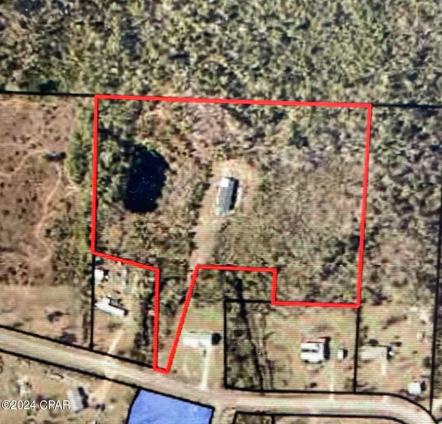 ***7.67 ACRES!! SELLER WILL FINANCE WITH 20% DOWN, 6% INTEREST RATE, 30 YEAR AMORTIZATION, WITH A 2 YEAR(24 MONTH) BALLOON, AND NO PREPAYMENT PENALTY*** 2356 square foot 4 bedroom, 3 bathroom manufactured home on a paved road sitting on almost 8 acres of land...with a pond! The possibilities are endless with this land. Repair the home, remove the home, build your dream home. Soooo many options. Seller has never occupied the property, bought it as a foreclosure and will not provide ANY disclosures. Currently there is no access to the mobile home as I will have to get a locksmith out to change the locks.