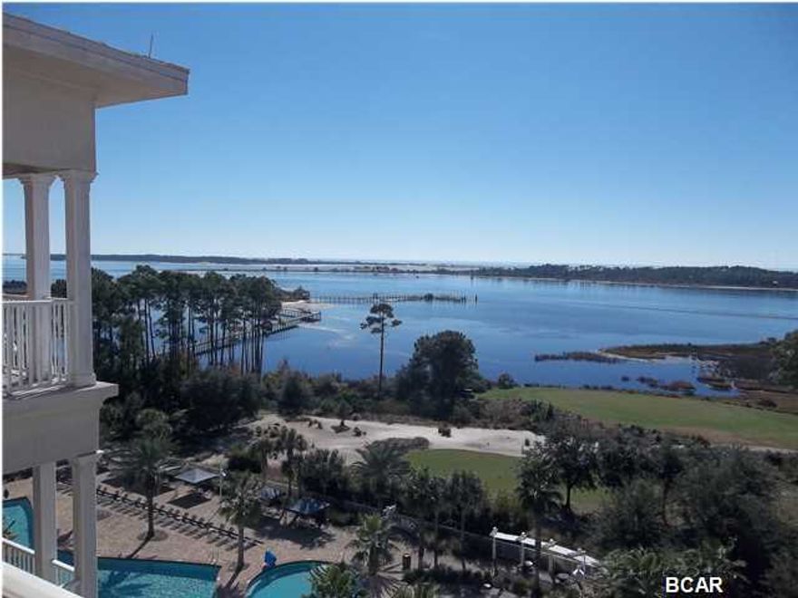SELLER SAYS BRING ME AN OFFER!!! BAY - WATERFRONT CONDO! REFLECTIONS CONDOMINIUM located on Marriott Drive! Absolutely beautiful TOP FLOOR unit with waterfront views from the Living Room-Kitchen-Dining Area-Master Bedroom and from the Master En-Suite Bathroom! And comes beautifully furnished. This condo also has very high ceilings throughout because of being on the top floor views from front and back of this condo are beautiful...water, golf course, etc. Granite counters in the very open kitchen, Black appliances, all neutral tone floors and walls. Great room designed to enjoy the Bay Waterfront views. Master bathroom has Double Doors that lead you into the open bathroom floor plan with seamless glass shower doors, double vanity and granite counters. Second bedroom is located in the  front of the condo for extra privacy. Step out onto the balcony either from the Great room or the Master bedroom and take in all the beauty and breezes that await you as you look out to St Andrews Bay!! Community amenities include a 10,000 square foot Tropical Resort Style Pool, Fitness Center, full service Serenity Spa and Salon, Indoor Pool, Whirlpool, TWO 18-Hole PGA Championship Golf Courses including the only Nicklaus Design Course in North West Florida! Four on-site Restaurants, Gift Shop and a Game Room! There's something for everyone at REFLECTIONS! (Buyer responsibility to verify any and all information including room measurements).
