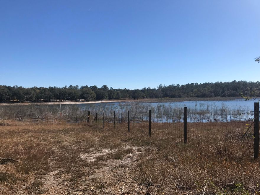 WATERFRONT on Grassy Lake! Lovely small neighborhood. This predominately Equestrian community offers access to miles of riding trails - this property is just around the bend from the water management access gates! With 3 acres, the possibilities are limitless! Quiet area, great retreat. Great property - Even better price! Don't miss this one, it's priced to sell! (all sizes approximate and taken from public records, buyer to verify any details buyer deems important).