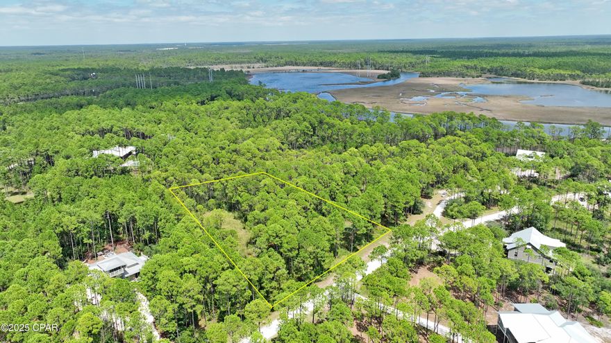 Build your dream retreat on this spacious 1+ acre lot in the exclusive RiverCamps community, nestled along scenic Crooked Creek with direct access to West Bay. Enjoy unmatched amenities including a private boat launch, day docks, and a protected boat basin perfect for kayaks, skiffs, and jon boats.

Residents also have access to a creekside campsite with tents, a fire pit, and bathhouse, plus 7+ miles of trails and boardwalks ideal for walking, biking, and exploring nature. Surrounded by preserved land and rich in wildlife, RiverCamps offers a rare blend of privacy, adventure, and coastal living, just minutes from Panama City Beach.