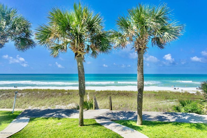 Currently under contracrt, now taking backups. Step right out your door to the gorgeous white sand and emerald waters of the beach! Imagine owning luxurious Panama City Beach oceanfront with your own lawn, sidewalks, palms, and seawall! This unit is light, bright, and beautifully decorated.   Watch the gorgeous Gulf of Mexico sunsets from kitchen/ living area,  master suite and bedroom upstairs! It is sold furnished except for some personal items. This three townhome complex has a seawall which is rare.  No association fees as you own your lot. The three units share the cost of common areas. This unit has never been rented. It is across from one of the local's favorite cafes, Sunnyside Grill!    Walking distance to ice cream shop, Carousel gourmet grocery store. West end of the beach is normally less busy! Vacation rentals allowed.Triplex can be purchased, please call for details.  Please verify all information and measurements.