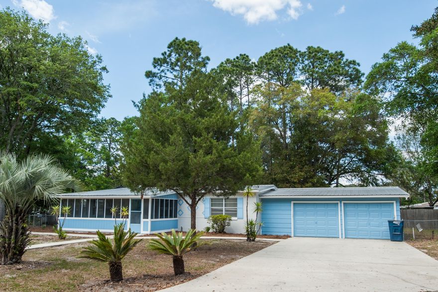 Totally remodeled and updated, central location, a huge double garage, and look at that price!  This beautiful home features new paint in designer colors, stunning and durable wood look vinyl plank floors, and a big shady corner lot! You will love the warm, natural wood kitchen cabinets and the new stainless steel stove and vent hood!  The master bedroom is bright and spacious and features a large closet with ventilated shelving.  Need covered parking or storage?  How about a huge 26x23 double garage, plus a 5x15 attached storage area!!!  The house has a new electrical panel and all of the plumbing supply lines have been replaced with freeze-proof PEX pipe.  It's all topped off with a durable metal roof.  This house won't last long, come and see it today!