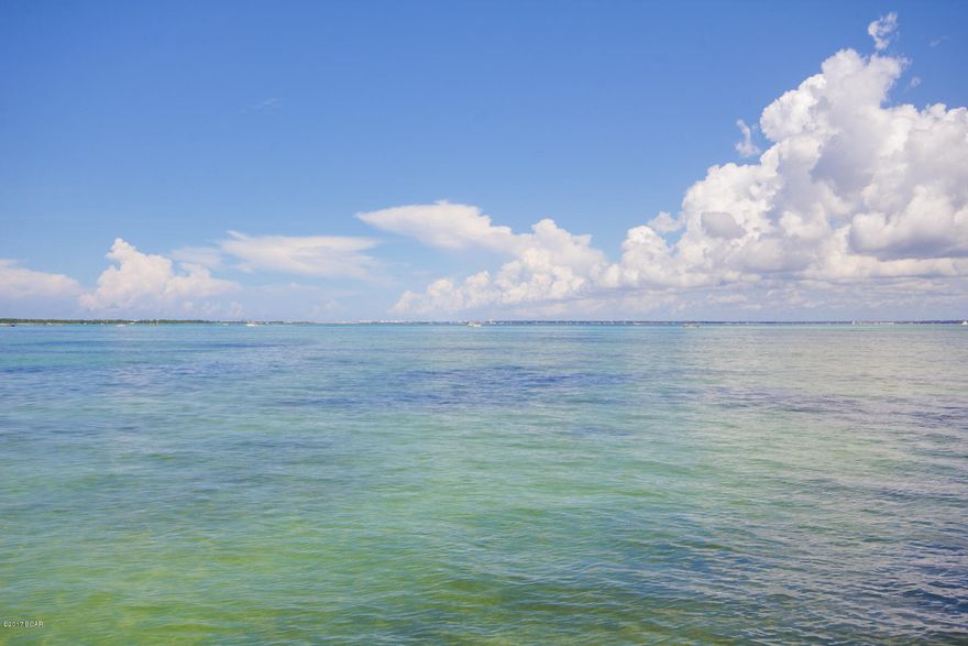 NEW PRICE + $50,000 updates rebates at closing with acceptable offer. A RARE OPPORTUNITY: prestigious home on Destin's most cherished waterfront. Very few homes can offer a bayfront view of the turquoise waters of Crab Island and surroundings. This property was among those first treasured by Destin's earliest settlers, not just for its incredible sunset views but for the bounty of fish and shellfish that can be found at the end of its dock. For those who want to be able to walk out their back door, go aboard their boat and be in the Gulf of Mexico in minutes, this property is one of the very few that can satisfy them. This home defines the Florida lifestyle that so many can only dream about. Don't miss this opportunity. The distinctive character of this home will never change but interior design fashion does. So the owner is offering a $50,000 rebate for updates/customization at closing with an acceptable offer. The discriminating buyer might want to update baths and such, but the "bones" of the house are solid and strong. It's a home for family gatherings, indoor/outdoor entertaining and sunset toasts. Generations have played on the small bayfront beach while adults keep an eye on them from the fabulous pool deck. Mature landscaping makes this generously sized lot an inviting spot for relaxation or recreation.
This home is part of a closely held 6-lot neighborhood. Please confirm all information.