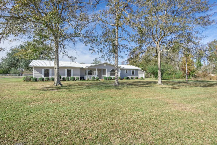 Beautifully remolded home located on a paved road!  This home features vinyl plank flooring throughout.  The kitchen and bathrooms feature granite countertops.  The exterior of the home features plenty of room for parking- with an attached and detached garage.  There is also an in ground pool.  This home is move in ready!  Garage has two additional rooms that would be a great fourth bedroom or man cave.