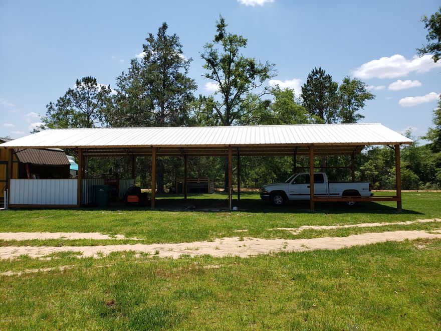 CURRENTLY UNDER CONTRACT,. SELLER WILL ACCEPT BACK UP OFFERS  Ready for you! Beautiful 4.8+/- acre parcel on the corner of Wildwood Cir and Joiner Rd in Chipley.  Property is cleared with a well, septic and power pole. Perfect for your new home or mobile home. 24x60 pole barn in place with area for storage and outside shower. 10x16 outbuilding with a loft.  Property is fenced with the front having a stocked pond, cross fenced for animals with water available. Peaceful country setting not far from town. Approx. 45 minutes to Panama City Beach to the south and Dothan, AL to the north.