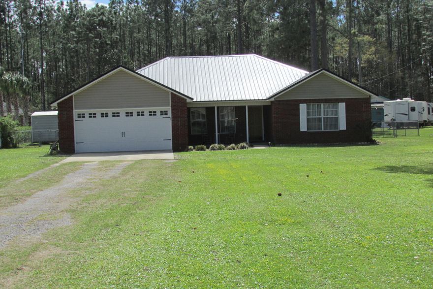 Very nice 4 bedroom 2 bath split floor plan home in a popular area close to Harders Park, great schools, hospitals, shopping and so much more.  Interior of home has been freshly painted, wood flooring was installed, dishwasher, stove/oven and hot water have all been replaced within the past 5 years, new metal roof and so much more. Home offers plenty of storage, features large bedrooms with 3 of the bedrooms having walk in closets, the master has a beautiful sitting with plenty of natural light.  Home is situated on over a half acre of land, has two workshops/yard buildings and will provide plenty of privacy.  This low maintenance home has so much to offer, call for your private showing today.  All ages, sizes, including square footage are approximate measure if important