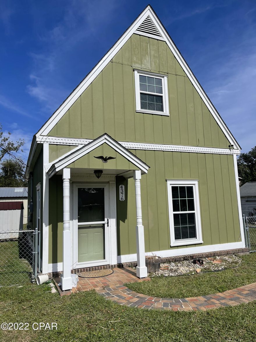 Charming 2 bedroom, 1.5 bathroom A-frame cottage in the heart of downtown Marianna! This home features wood looking vinyl plank floors in the living, dining and kitchen. The main bedroom and full bathroom are downstairs. There is a laundry closet in the downstairs bedroom. The bedrooms are both carpeted. There are also plantation shutters on all of the downstairs windows. The additional bedroom space is upstairs and has a loft feel. It has built in shelving & cabinets, two closets and a half bath. It could be used as a bedroom, office or bonus room. The backyard is completely fenced in. The home is within walking distance of Wynn St park and it is in close proximity to Jackson Hospital, the conveniences of downtown, Marianna K-8 a