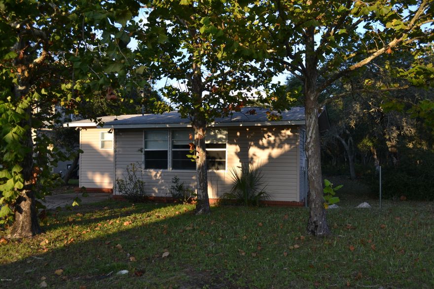 Really cute beach cottage with 2 bedrooms and 2 full baths.   Super short walk to World's Most Beautiful Beaches!  Nice deep lot.   Kitchen has been updated with new cabinets and counters.   Has 8x20 Florida room across the front, and an 11x6 utility room on back with washer/dryer hookups and some extra storage.   Vinyl siding on exterior of home.   Nice deep fenced backyard.  Check it out today!