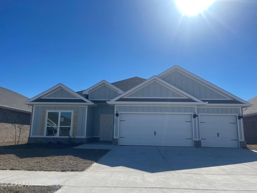 The Destin is a spacious one-story, four-bedroom, three-bathroom, three-car garage floorplan. As you enter this home you are covered by a small front porch and walk into a foyer. This is a nice Split floor plan with the home's first two guest bedrooms and one guest bathroom off of the foyer. If entering through the garage, you will walk directly into a spacious laundry room and then into the home's kitchen and living room area that has a nice Open Concept, with the center kitchen island with a sink, which is very convenient for watching TV and entertaining your guests while cooking. The home has 9' ceiling throughout the house with lovely trey ceilings in the large Living room and Main Bedroom.
The kitchen has an upgraded Gourmet kitchen, meaning it comes with a separate stainless-steel cooktop/wall oven/ wall microwave/hood vent and a dishwasher. There is also a large walk-in Pantry and you have cabinets on both sides of the kitchen island for extra storage as well.
Towards the back of the home are the third guest bedroom and the guest bathroom. The Main first bedroom is located away from all of the bedrooms, in the back corner of the house, giving you more privacy.
Main Bathroom has a double vanity, walk-in closet, a separate Garden tub and a separate Shower with a Glass door. There is also a Window in the Main Bathroom, giving you plenty of natural light!
All countertops in the kitchen and bathrooms are granite, flooring in all the main and wet areas is the Luxury Vinyl Plank and there is carpet in all bedrooms.

The Lot is 0.14 of an acre giving you a spacious Back yard.
The driveway is large, considering it is a 3-car Garage home, giving you plenty of parking space.
Sod is done for the whole lot, front, back and sides, also with some nice landscaping with shrubs upfront.

AREA:
Hodges Bayou community is located off of HWY 77A (also called HWY 2321), which is conveniently located between 2 major Highways 231 that can lead you to Panama City, Bayou George, Callaway, Youngstown, Fountain, Cottondale and Marianna, and HWY 77, which can lead you to Lynn Haven, Panama City, Panama City Beach, and also Vicksburg, Sunny Hills, Econfina Creek, and Chipley.
Main grocery stores are just 11 minutes' drive (4.3 miles), however there are also plenty of convenient stores within 4 minutes' drive as well. Northwest Florida Beaches International Airport is just around 19 minutes' drive (15 miles), 20 minutes (12 miles) to Downtown Panama City, 18 minutes' drive (10 miles) to Gulf Coast Medical Center, 25 minutes' drive (11 Miles) to Sacred Heart, 30 minutes' drive (12 miles) to Tyndall Air Force Base,
Panama City Beach is just around 35 minutes' drive, Econfina Creek is just around 30 minutes' drive, however there is a public Boat Ramp with a little local Beach rest area with picnic tables and a playground right off of HWY 77A, which is just 1 minute drive! The community itself has its own Playground area for your kids, which is conveniently located further away from the main Highway.
Lynn Haven Bayou Park and Preserve is located just around 3 miles away, that has gorgeous nature trails, playground areas and a nice beach as well!