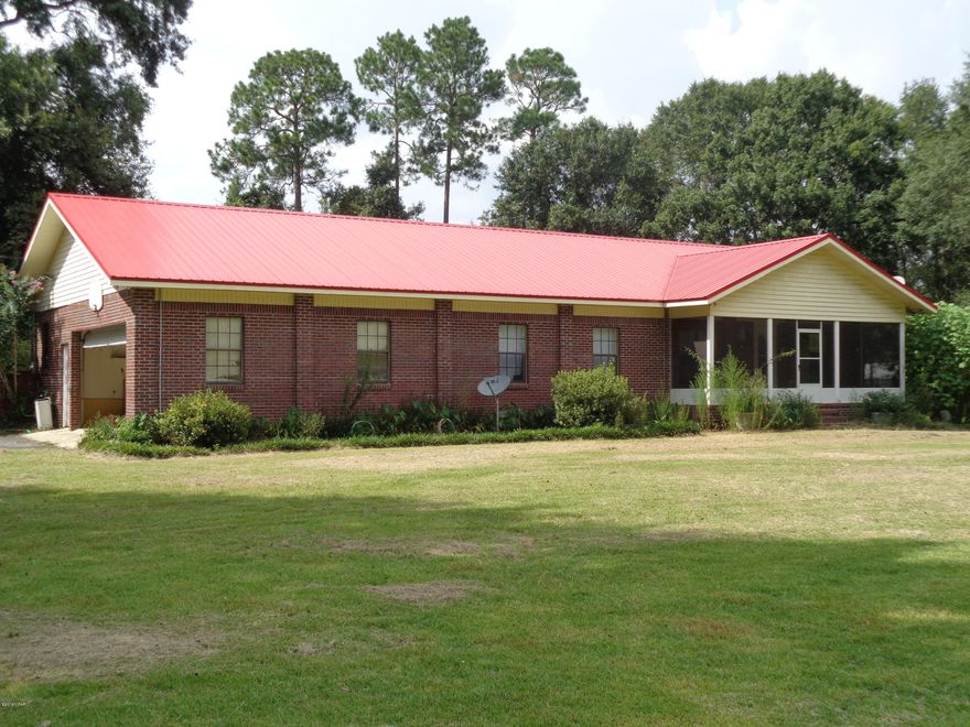 This property sits on 5 acres with 2 wells and a  septic tank for Mobile Home hookup.Home features 4 bedrooms and 3 baths. Family room has a brick fireplace. There are 2 master suites in the house and a third hall or quest bathroom.Large rear deck that is 49 x 16.Home has exterior brick siding. The roof and Air are approx. 2 years old. Come enjoy the quiet country living but yet close to town, There are 2 fish ponds on the property with fencing in place.