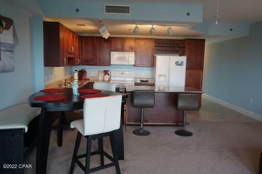 INCOME PRODUCING UNIT!! This unit will not last long. A one bedroom two bathroom, (hidden bunk bed nook included), unit with a lake view in one of the most popular condo towers on the beach, Laketown Wharf Resort. Located a street crossing away from the sand, just yards from some of the most popular restaurants on the beach, walking distance to Walmart, several shops and other amazing attractions, its location is unbeatable. Also boasting its own list of amazing amenities, pools, food, entertainment, gym, you really don't NEED to leave the property, but how can you not when you can smell the beach you're so close to it and there is so much to do in such close proximity. Unit is being sold furnished. STR friendly. MAJOR tourist STR location. This is a great investment for someone looking for another income stream, and who also wants to keep a get away in their back pocket when they need a break. Act fast, because this money maker will be gone fast!