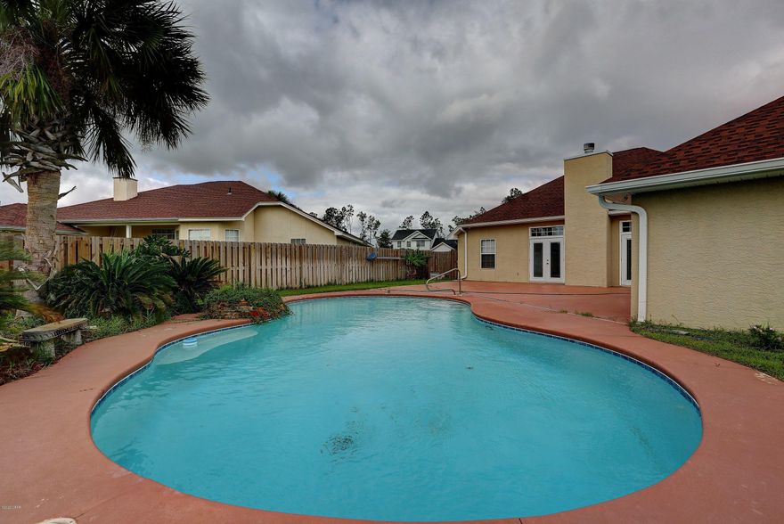 CURRENTLY UNDER CONTRACT, SELLER ACCEPTING BACKUP OFFERS! MOWAT HIGHLAND HM ON A CORNER LOT W/BEAUTIFUL POOL!  Spacious 3/2 home has large eat-in kit with breakfast bar and island.  Living  room has fireplace with lovely mantel and surround, formal dining area and the MBR is huge! MBA has dbl vanity, large walk-in closet, garden tub, water closet and separate shower. The large laundry room leads to an oversize garage with extra storage rooms. There is a personnel door that opens onto the pool deck, made for entertaining, from the garage. This home is move-in ready and located in a wonderful neighborhood near the best schools.  NO HOA fees and located in flood zone X, which does not require flood insurance.