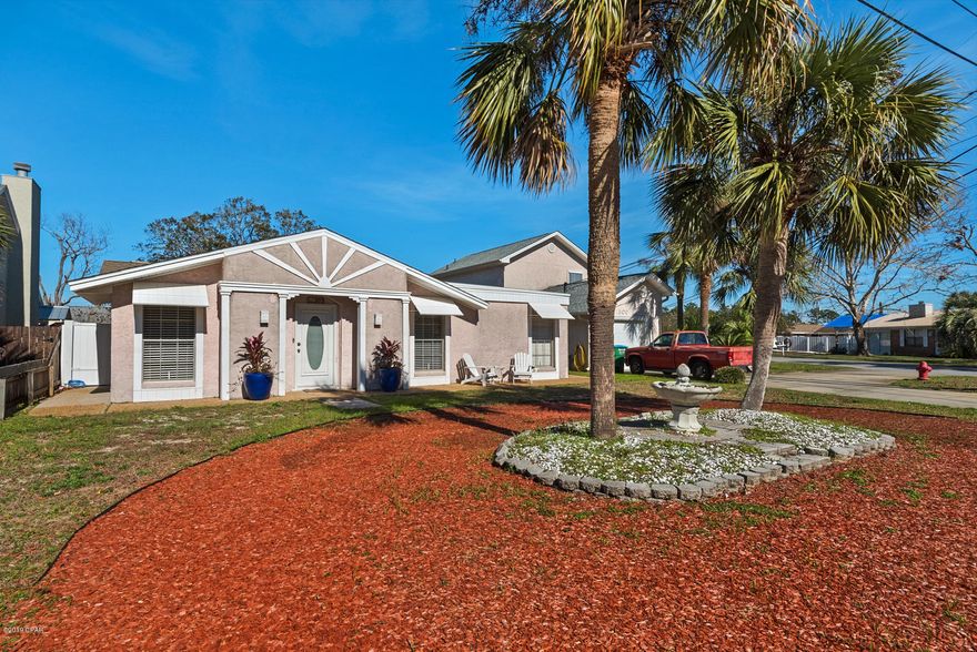 Back on market after excellent inspection! The perfect little beach house that checks all of your boxes. 1,640 square feet with 3 BR's/2 baths plus an outdoor shower,  so it's just the right size& everyone can get ready for school or a night on the town. If you prefer to stay at home, the large open floor plan is perfect for entertaining and the floor plan easily flows from inside to out. The screened lanai and gazebo in back makes it easy to enjoy your private back yard. There's even a large workshop in the back that's perfect for working on almost anything or it could be a nice craft room or a pool house. If you're not crafty or  handy with tools, you have an excellent place to store whatever you want. Close to Pier Park and only 2,300' to beach.