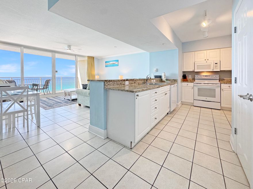 This spacious Gulf-front residence at Emerald Beach Resort offers one of the largest and most desirable 1-bedroom floor plans in Panama City Beach. Designed to maximize both comfort and views, the open living and dining area features a dramatic 12-foot wall of floor-to-ceiling glass, seamlessly connecting to a private balcony where stunning Gulf views become part of your everyday living experience.

The well-appointed kitchen includes granite countertops and a convenient breakfast bar, ideal for casual dining or entertaining. This unit comfortably accommodates up to six guests with a spacious primary suite (king bed), a built-in bunk nook, and a queen sleeper sofa. Two full bathrooms provide added convenience for owners and guests alike.

Thoughtfully designed for low-maintenance coastal living, the condo features tile flooring throughout the main living areas, an in-unit washer and dryer, and a functional layout that lives larger than expected. Positioned on the 11th floor, enjoy a perfect balance of elevated views and privacy, with high-speed elevator access for ease and convenience.

Resort-style amenities include multiple pools (Gulf-front pool, zero-entry splash pool, and seasonally heated options), hot tubs, fitness center with day spa, Sky Bar, grilling areas, on-site dining including Starbucks, gift shop, convention center, and approximately 1,000 feet of private beach frontage.

Ideally located just minutes from Pier Park, popular dining spots like Sharky's Beachfront Restaurant, and top attractions including Topgolf Panama City Beach and Pirate's Voyage Dinner & Show, this property offers outstanding potential as a primary residence, second home, or investment opportunity.

Property is being sold as part of a bankruptcy proceeding and is subject to court approval. Buyer to verify all details and timelines associated with the sale.