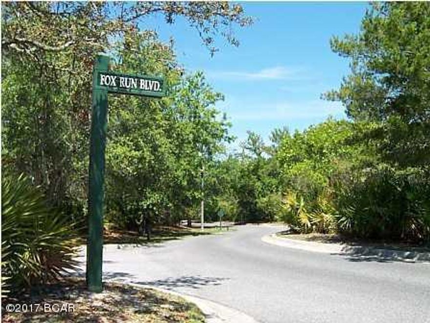 THIS IS A WOODED LEVEL LOT IN A SOUGHT AFTER COMMUNITY.  THERE IS AN ADJOINING LOT THAT IS AVAILABLE AS WELL. YOU MUST HAVE THE MLS SHEET AND A CARD WITH YOU TO ENTER THE GUARD GATE.