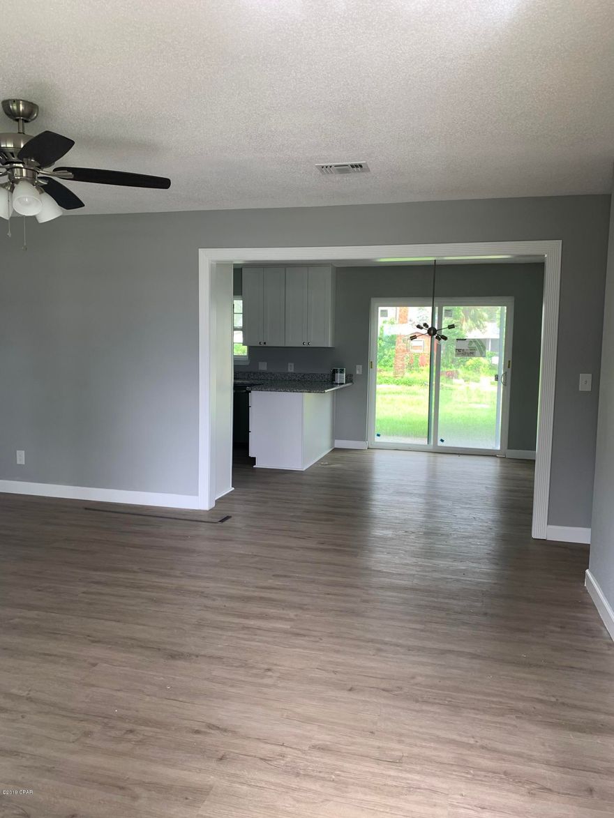 Beautiful 4 bedroom 2 bath home. Vinyl laminate flooring throughout except for the baths are tiled. Open kitchen/dining area with breakfast bar, granite counter tops with Stainless appliances. Large corner lot.