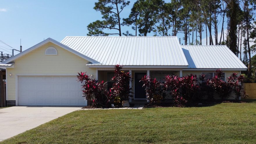 WOW!! NEW METAL ROOF AND LOCATION PUTS THIS HOME OVER THE TOP!  Sparkling Pool! Just minutes to the World's Most Beautiful Beaches and Bay Point. Seconds to the Navy Base. With it's perfect blend of color and wood decor this cozy 3/2 has all of the beach charm. The home features an open/split floor plan and a stainless appliance package in the kitchen with plenty of cabinet space. Master bedroom boasts a beautifully decorated pallet board accent wall along with its own private access to the back yard through the sliding glass door, where you can slide out back to the deck and  enjoy a glass of wine while relaxing in the HOT TUB. The unique dock style walk way leads from the garage to the deck where the cabana and hot tub are located, while the other end of the deck accompanies the enclosed above ground pool. This space is absolutely perfect for entertaining. Only 15 minutes from Pier Park. Just minutes from Schooners, St Andrews State Park, and so much more.