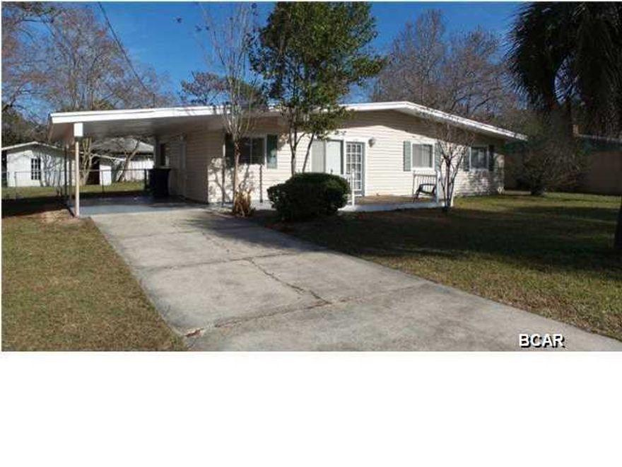 Great opportunity if you are looking for an investment property or for the first time home buyer. Centrally located in the Forest Park subdivision of Panama City. This home offers 3 bedrooms, 2 full baths, living room, kitchen and dining area. This home also offers an open patio on both the front and back sides of the home. The back yard is chain-link fenced and includes an outside storage building. Carport and driveway parking is available.