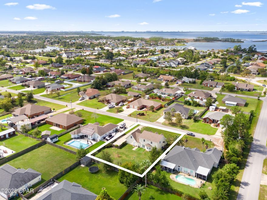 Located in a top-rated school district and set on a quiet cul-de-sac in the heart of Lynn Haven, 1403 New Jersey Avenue is a spacious five-bedroom, two-and-a-half-bath home designed for connection, comfort, and everyday living. Soaring ceilings, a first-floor primary suite, and generous upstairs living space create the ideal backdrop for both family life and entertaining.

The main level welcomes you with a bright, airy living room featuring vaulted ceilings that enhance the home's open feel. The primary suite is conveniently located on the first floor, offering privacy and ease of access. An open kitchen and dining area make hosting effortless, while thoughtful upgrades—including a whole-home surge protector, reverse osmosis water filtration and softener, and a brand-new water heater (2026)—add peace of mind. An oversized two-and-a-half-car garage and spacious driveway provide ample parking and storage.

Upstairs, four additional bedrooms and a full bath offer flexibility for family, guests, or a home office. Located in a golf-cart-friendly neighborhood with no HOA, this home is close to a nearby sports complex and everyday conveniences. Bay access and surrounding nature preserves add to the area's appeal, while the new Publix and commercial development along Highway 390 enhance daily living. Frequently ranked among the ''Top 10 Best Places to Live in Florida,'' Lynn Haven delivers a lifestyle defined by community, comfort, and value.