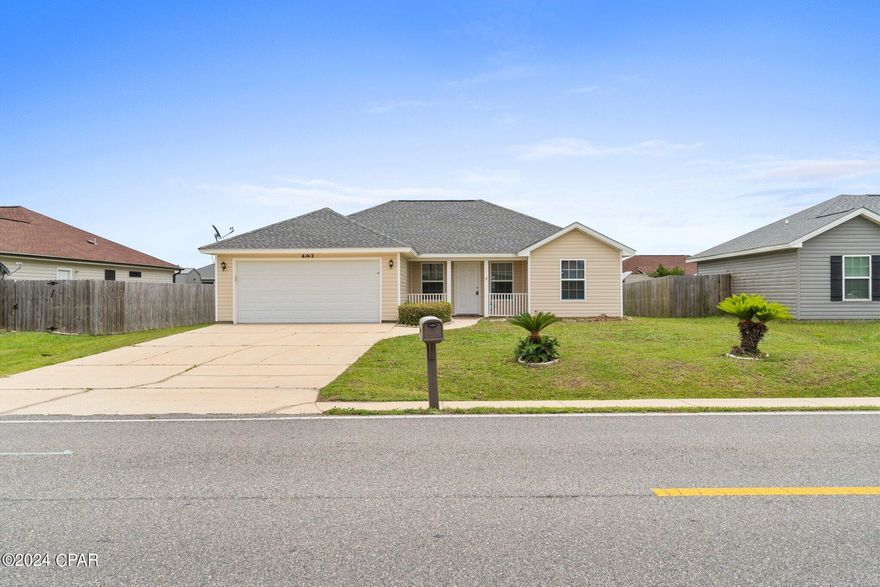 This charming home is a  4 bedroom, 2 bath with 2 car garage nestled within the  Cherokee Heights Subdivision. It boasts a thoughtfully designed split bedroom floorplan. The interior has been freshly painted and awaiting your personal touch. 
The living room area features vaulted ceiling with plant and decor shelving which adds a touch of personality. The kitchen, features  a built-in microwave, dishwasher, refrigerator, and electric range. The convenient breakfast bar adds a touch of functionality, perfect for casual dining. The master bedroom is spacious and features trayed ceiling and a large walk-in closet for all your storage needs. Step outside to discover a large covered back porch, the perfect spot for hosting family gatherings and entertaining in the privacy of your backyard. The roof was replaced in 2019. A new air conditioning system installed in 2023 and a new water heater in 2024. Convenience is key in this family-friendly neighborhood, with schools  located within the community and there is Not an HOA. Enjoy easy access to shopping, restaurants, entertainment, Tyndall AFB, and Panama City Beach. Schedule your tour today!