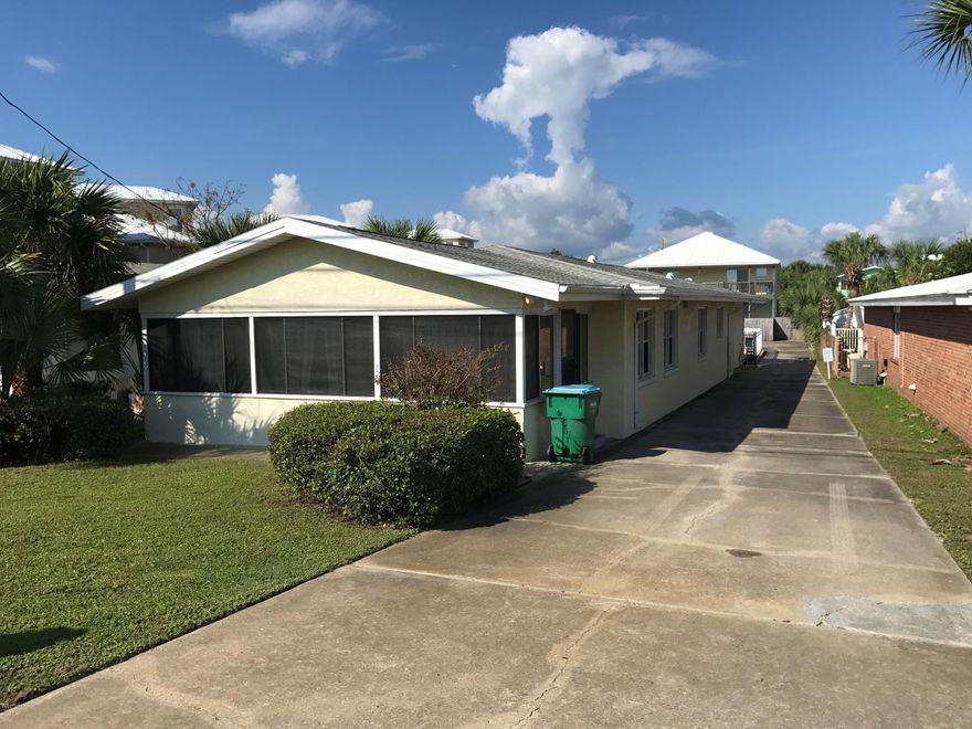 Welcome to Wait's Beach Manor (House & Duplex) at 21924 Front Beach Road & 21915 Belgrade in Panama City Beach, Florida. This is truly a unique compound. The primary home is a fantastic 2,150 square foot beach cottage with open living spaces, a very large living room, plenty of dining seating, 3 Bedrooms & 3 FULL Baths, Gulf Views, a Private Pool, oversize detached garage and tons of parking. Located directly across the street from the beach with a super convenient dedicated beach access. The adjacent Duplex has wonderful gulf view and produces a steady stream of long term rental income. Wait's Beach Manor puts you right at the beautiful beach so you can soak up some sun and relax. This is sold as one compound and will not be separated. Measurements per this mls are for main house.