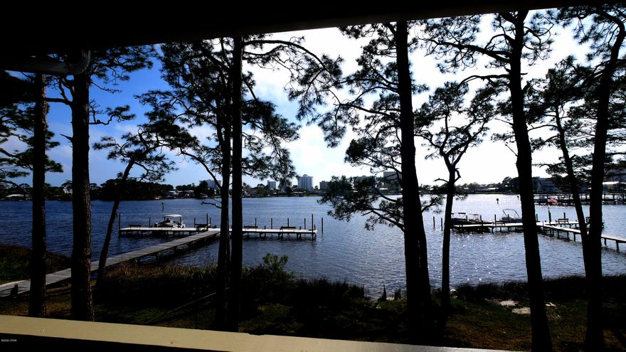 Available May 1st - Enjoy amazing views from this 2nd floor corner unit -1 bedroom 1 bath Waterfront Condo on Grand Lagoon.  Some utilities included - Tenant pays electric, internet and upgrades to basic cable. Complex offers community pool, tennis court, and a dock on the Lagoon. No pets allowed. This unit is unfurnished.